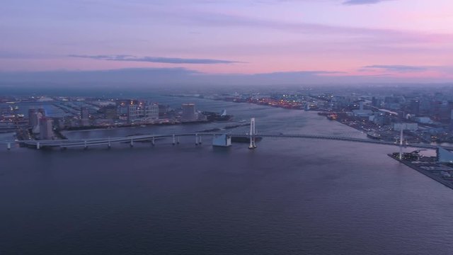Japan Tokyo Aerial v139 Flying over harbor panning at dusk with cityscape industrial views