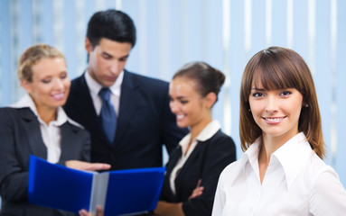 Portrait of happy smiling businesswoman at office