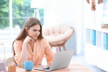 Young woman working at home