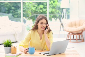 Young woman working at home