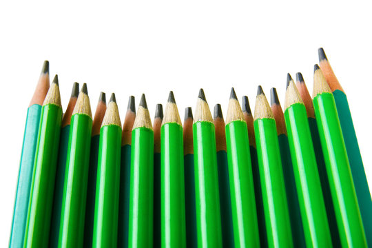 Green pencils on white background