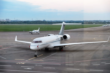 Modern plane in big city airport