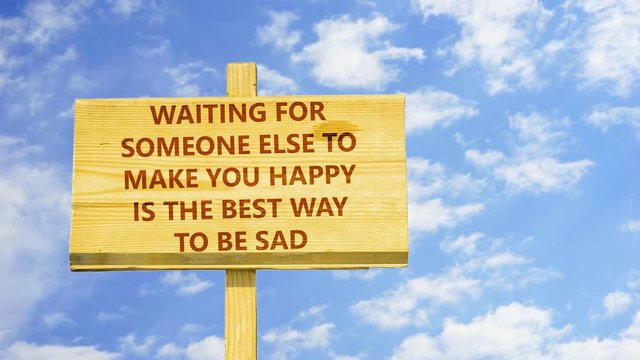 Waiting for someone else to make you happy is the best way to be sad. Words on a wooden sign against time lapse clouds in the blue sky.