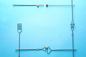 Frame made of logopedic probes for speech correction on color background