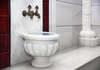 Traditional marble kurna in turkish hammam