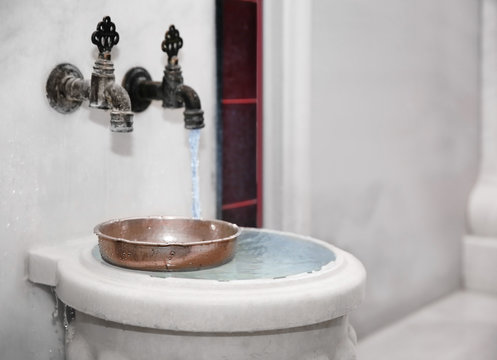Traditional marble kurna with bowl in turkish hammam