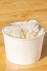 Steamed rice close-up on wooden background

