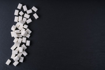 White sugar cubes and crystal sugar,top view