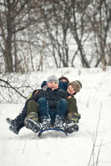 Fototapeta na wymiar children sled in winter in fresh air