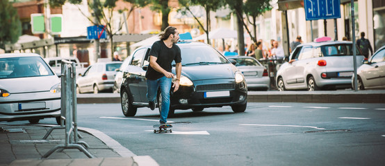 Professional skater riding skate on streets through cars and traffic © guruXOX