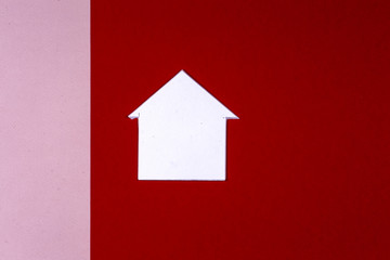 House and key on bright colorful background