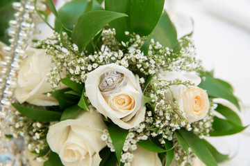 Beautiful white wedding bouquets in basket backgraound bouquet flowers rose / wedding rings