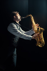 Young man playing the Saxophone