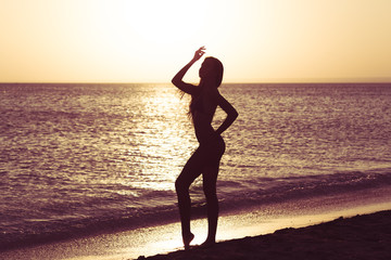 Fototapeta premium Woman is alone at beach