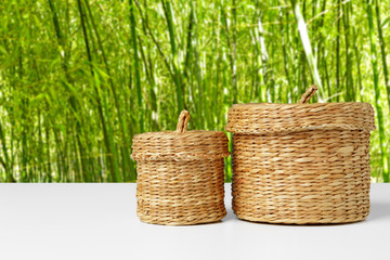 Background with empty basket on wooden table