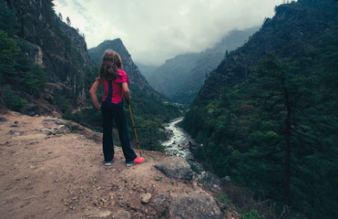 Child lokking at the valley, Himalayas mountains