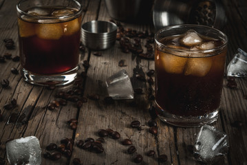 Alcohol. Drinks, Boozy Black Russian cocktail with vodka and coffee liquor on rustic wooden table. copy space