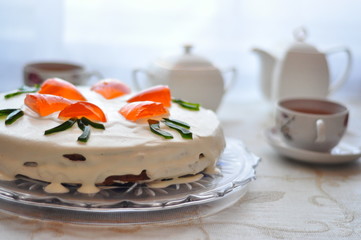Carrot cake surrounded by white tea set