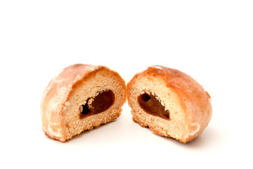 Half of the gingerbread with condensed milk on white
