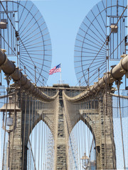 Obraz premium Brooklyn Bridge Tower with USA flag - Brooklyn, New York, NY, United States of America, USA
