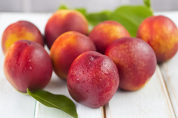 Fresh  nectarines on a wooden table, selective focus