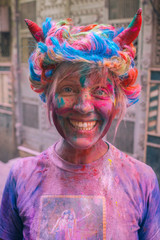 Woman with Holi colors in her face