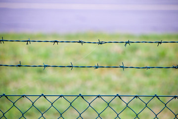 Restricted area - fence with barbed wire.