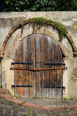 Old wooden gate in a wall