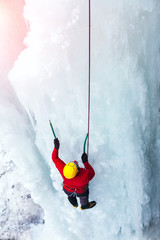 The climber climbs on ice.