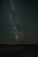 The Milky Way band with the galactic core setting on the horizon of Yellowstone National Park.