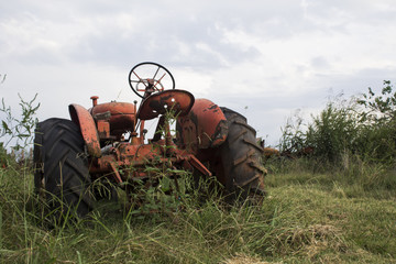 rusted antique farm tractor machinery