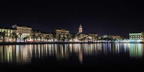 Split Riva at Night from the Harbor - Diocletian's Palace and the Riva with lights reflected on the river.