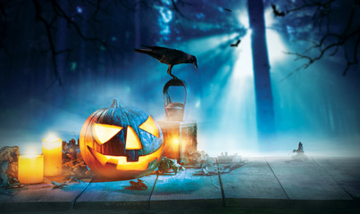 Spooky halloween pumpkin on wooden planks