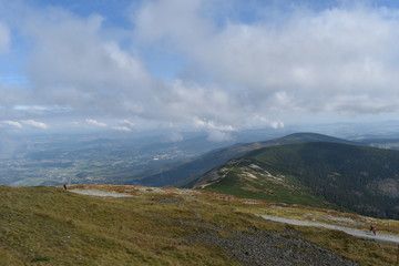 Panoramic View of Mountains with Meadow, Blue Sky and Clouds