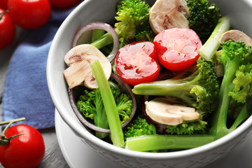 Dish with broccoli salad on table, closeup