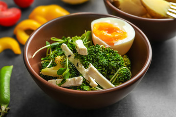 Dish with broccoli salad on table