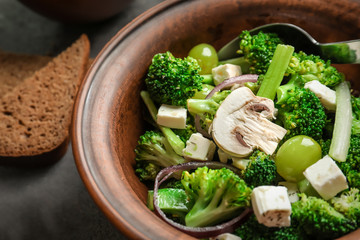 Dish with broccoli salad on table