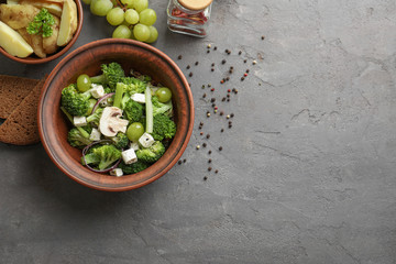 Dish with broccoli salad on table