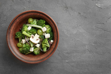 Dish with broccoli salad on table