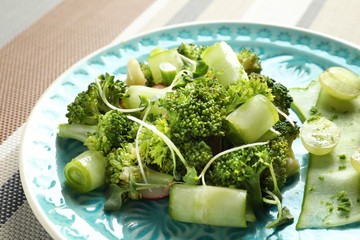 Plate with broccoli salad on table, closeup