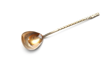 Spoon with cooking oil on white background