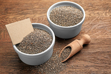 Composition with chia seeds in kitchenware on table