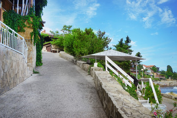 Narrow descending street near seacoast