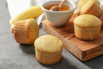 Fresh banana muffins on table, closeup
