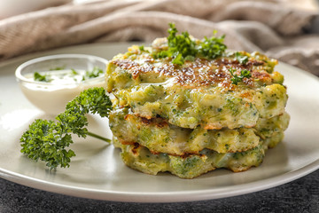 Plate with delicious broccoli pancakes, close up