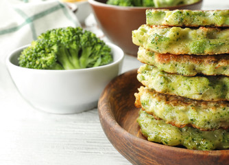 Delicious broccoli pancakes on table, close up