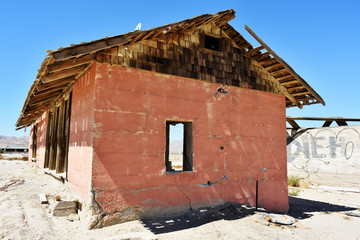 Weathered wooden structure in the desert.