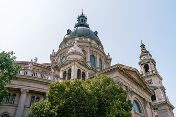 Fototapeta na wymiar St. Stephen's Basilica, the largest church in Budapest, Hungary. Exterior in summer sun light with blue sky