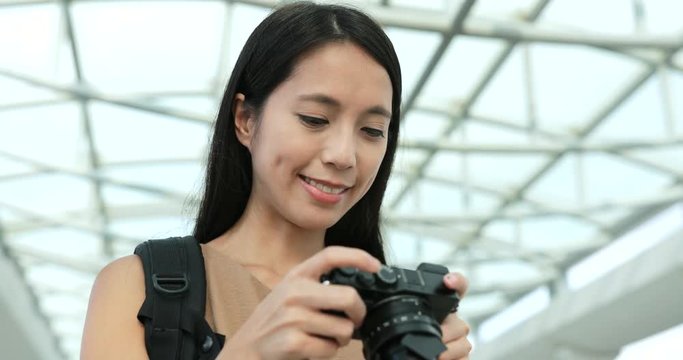 Woman taking photo with digital camera