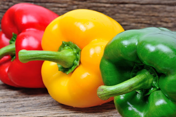 Group of colorful pepper on wooden background